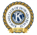 Seal or emblem for the Kiwanis Club of Howard Beach, featuring the club name, lighthouse, and a sailor or fisherman figure.