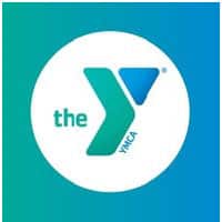 The YMCA logo, featuring a white "the YMCA" text on a teal circular background.